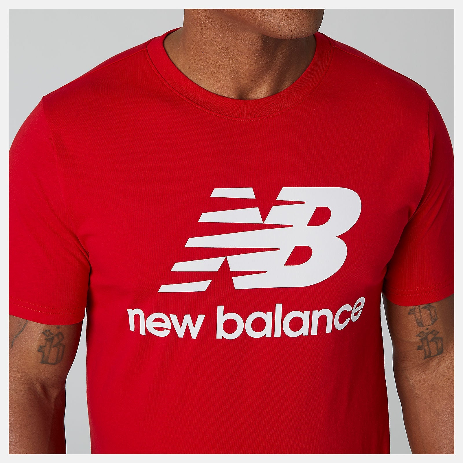 Essentials Stacked Logo Tee | New Balance Clothing Team Red - Men