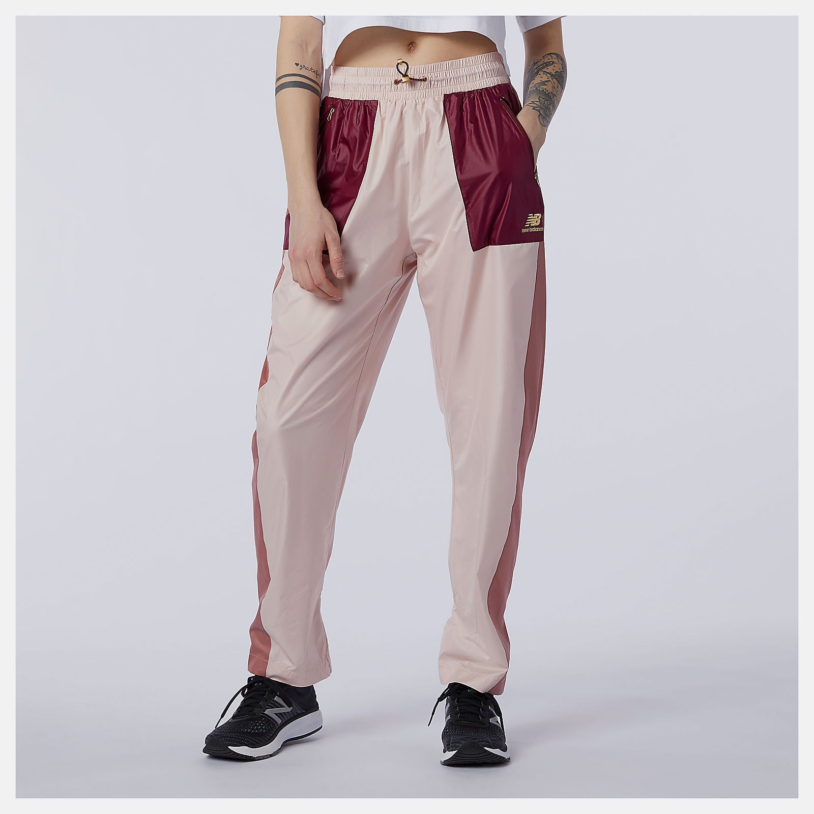NB Athletics Higher Learning Wind Pant | New Balance Clothing Oyster Pink - Women