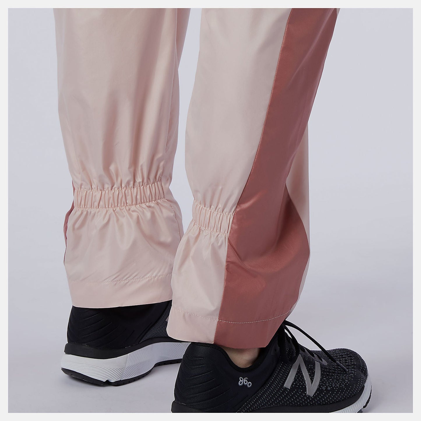 NB Athletics Higher Learning Wind Pant | New Balance Clothing Oyster Pink - Women